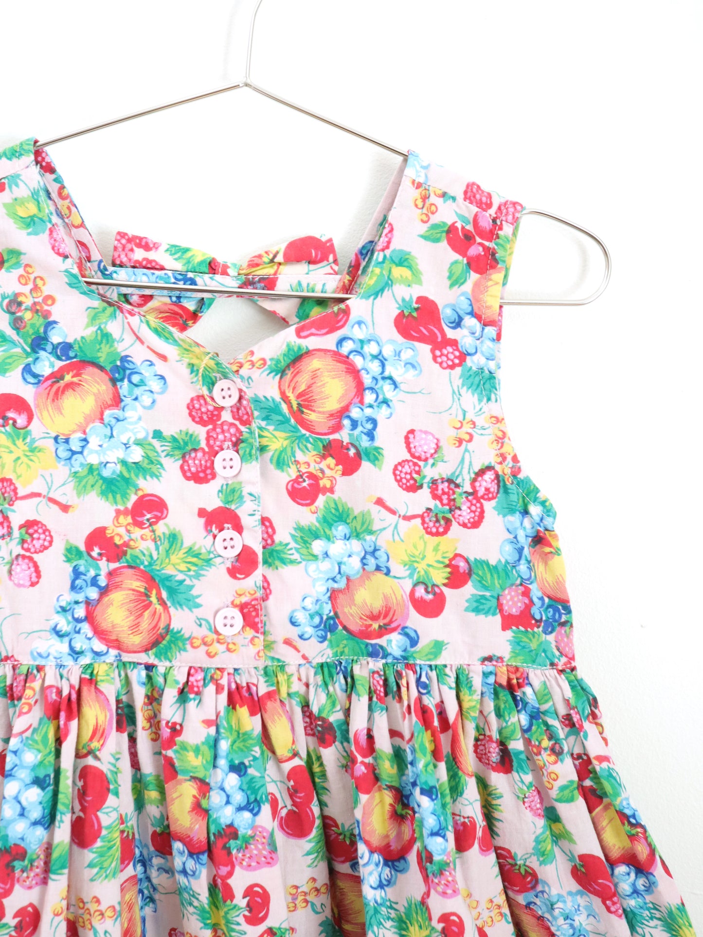 Robe vintage à imprimé fruits roses et nœuds dans le dos / 4 ans